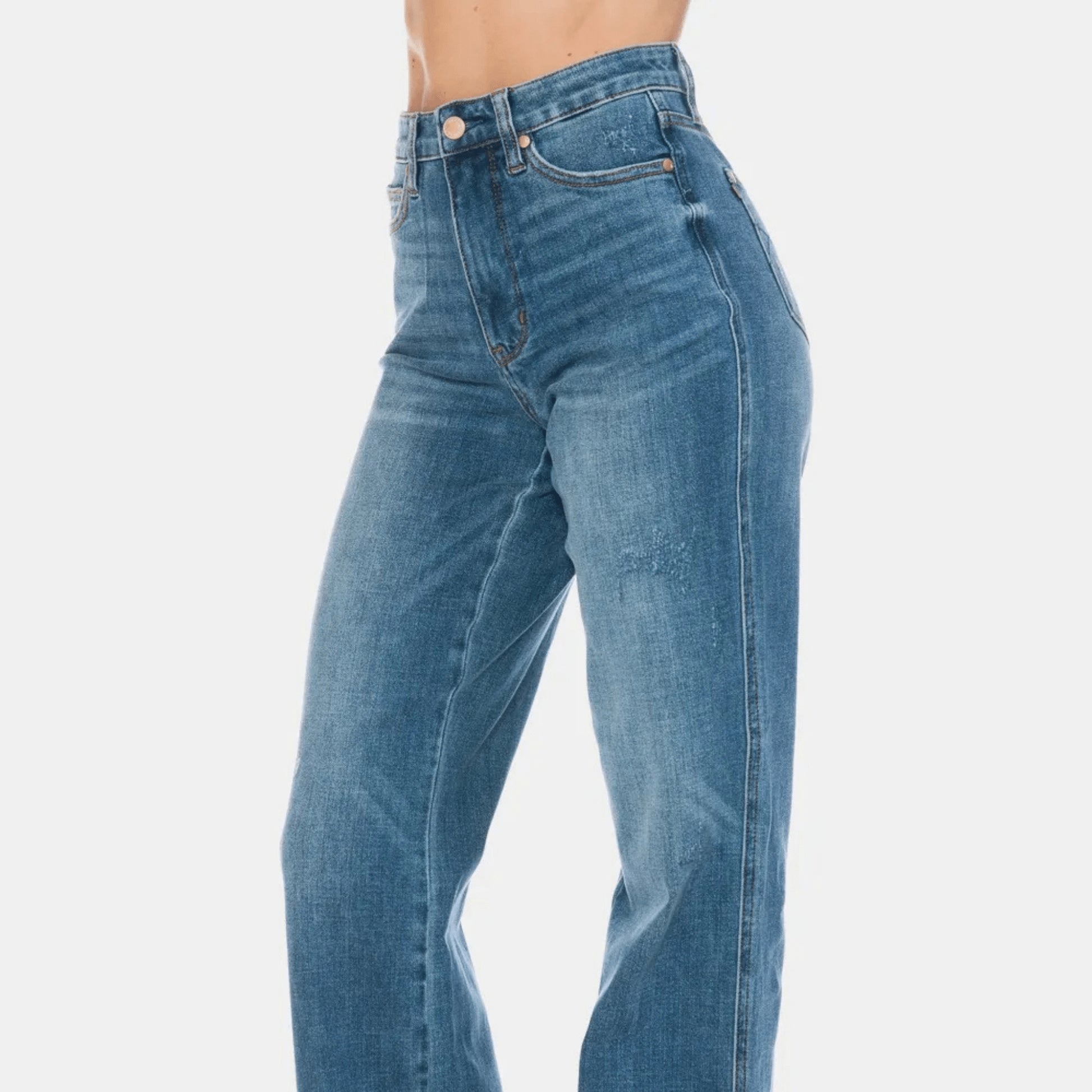 Side profile of dark wash straight jeans highlighting the smoothing tummy control fit.