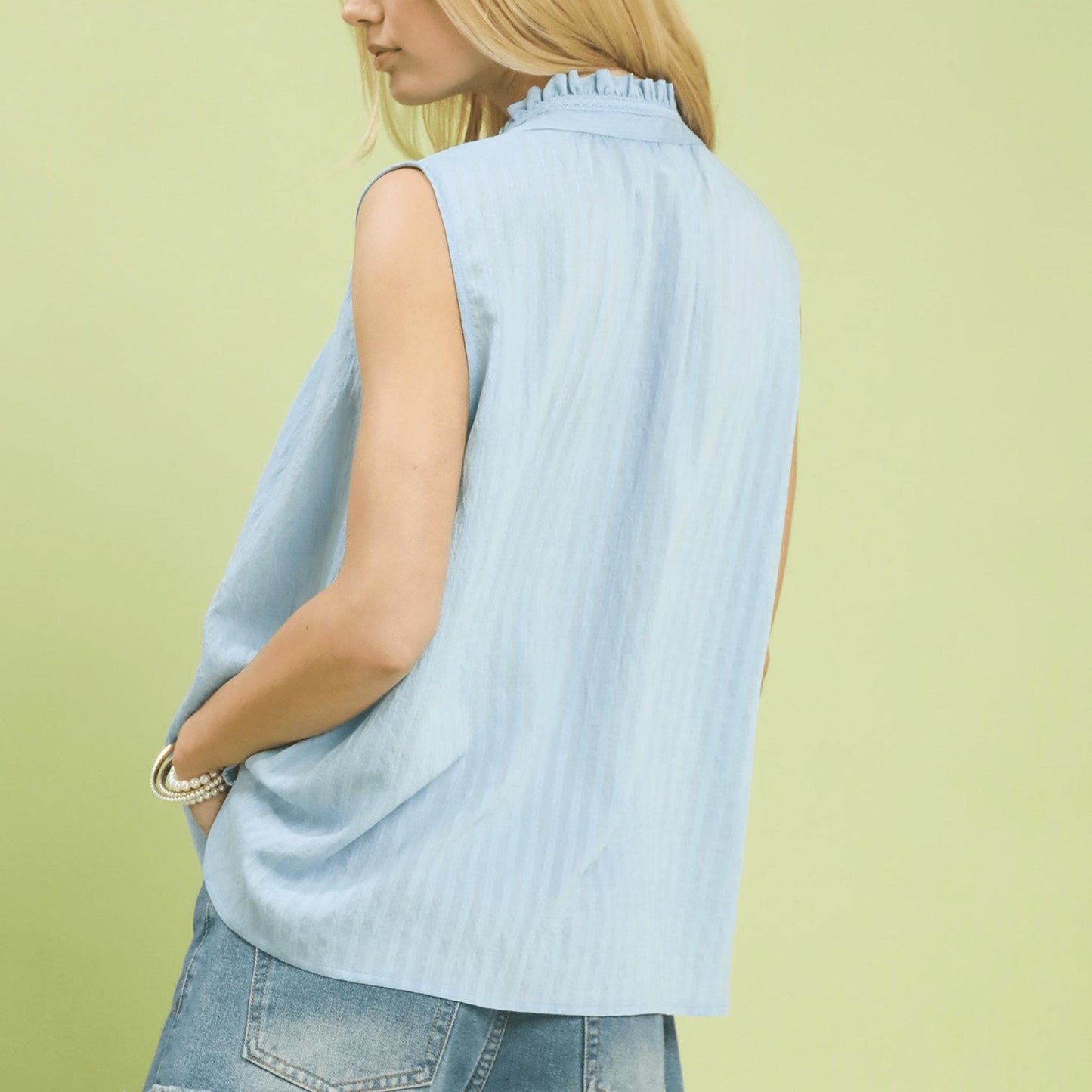Back view of the peri blue sleeveless top highlighting the breathable gauze fabric.