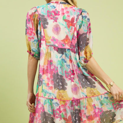 Back view showing the soft pastel watercolor print and lightweight fabric drape.