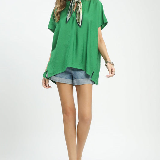 Full-length view of the Umgee flowy V-neck blouse highlighting its oversized, airy silhouette.