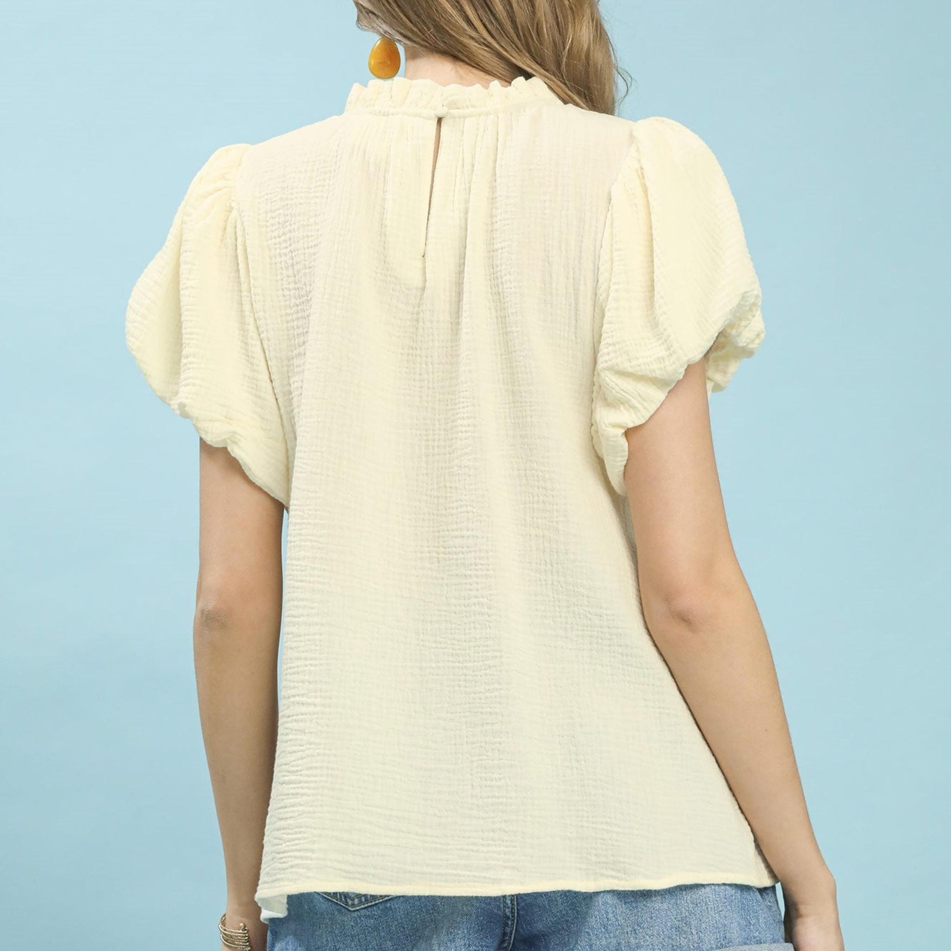 Back view of the Umgee Cream boho top highlighting the airy, oversized silhouette.