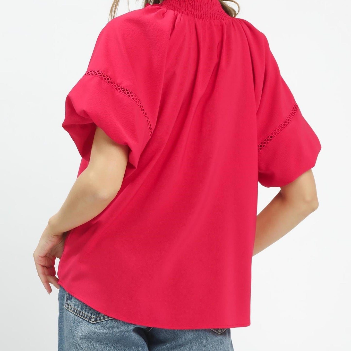 Back view of the romantic teaberry pink top highlighting the lightweight, flowy silhouette.