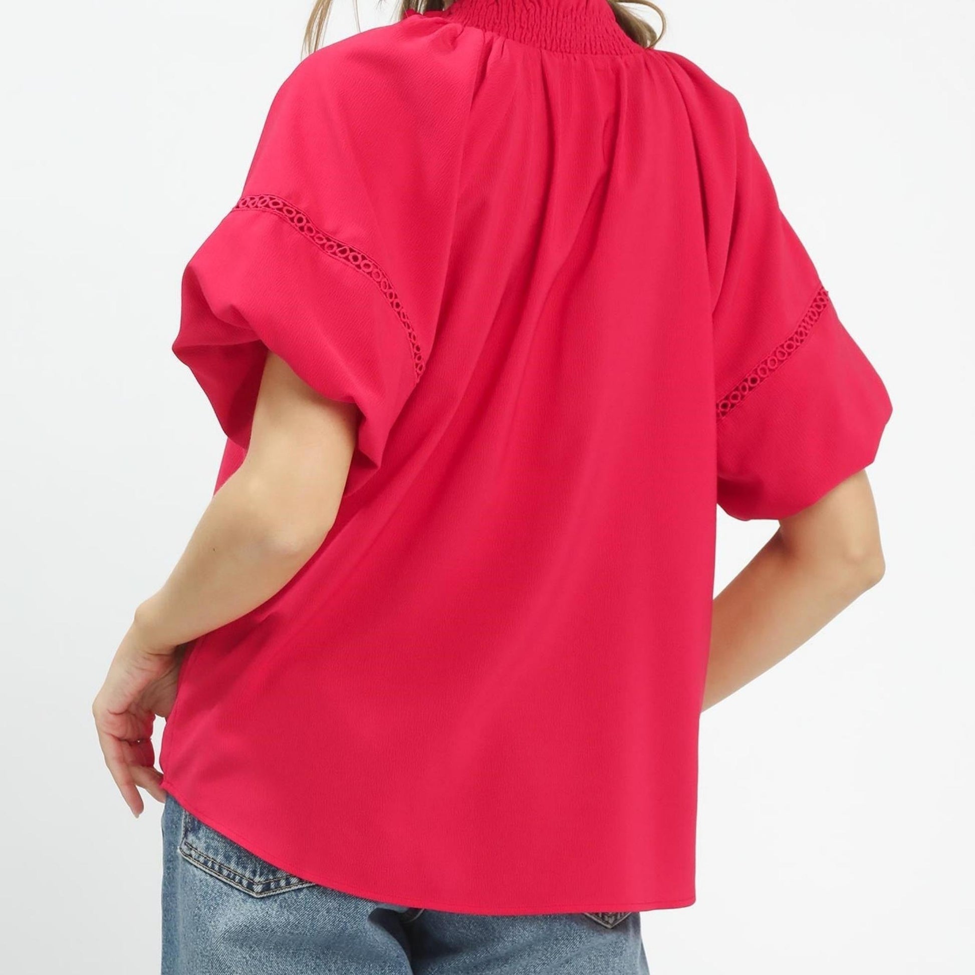 Back view of the romantic teaberry pink top highlighting the lightweight, flowy silhouette.