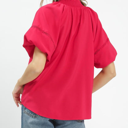 Back view of the romantic teaberry pink top highlighting the lightweight, flowy silhouette.