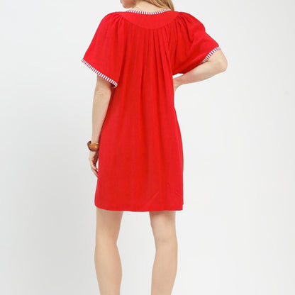 Close-up view of the airy and lightweight red Umgee linen dress fabric.