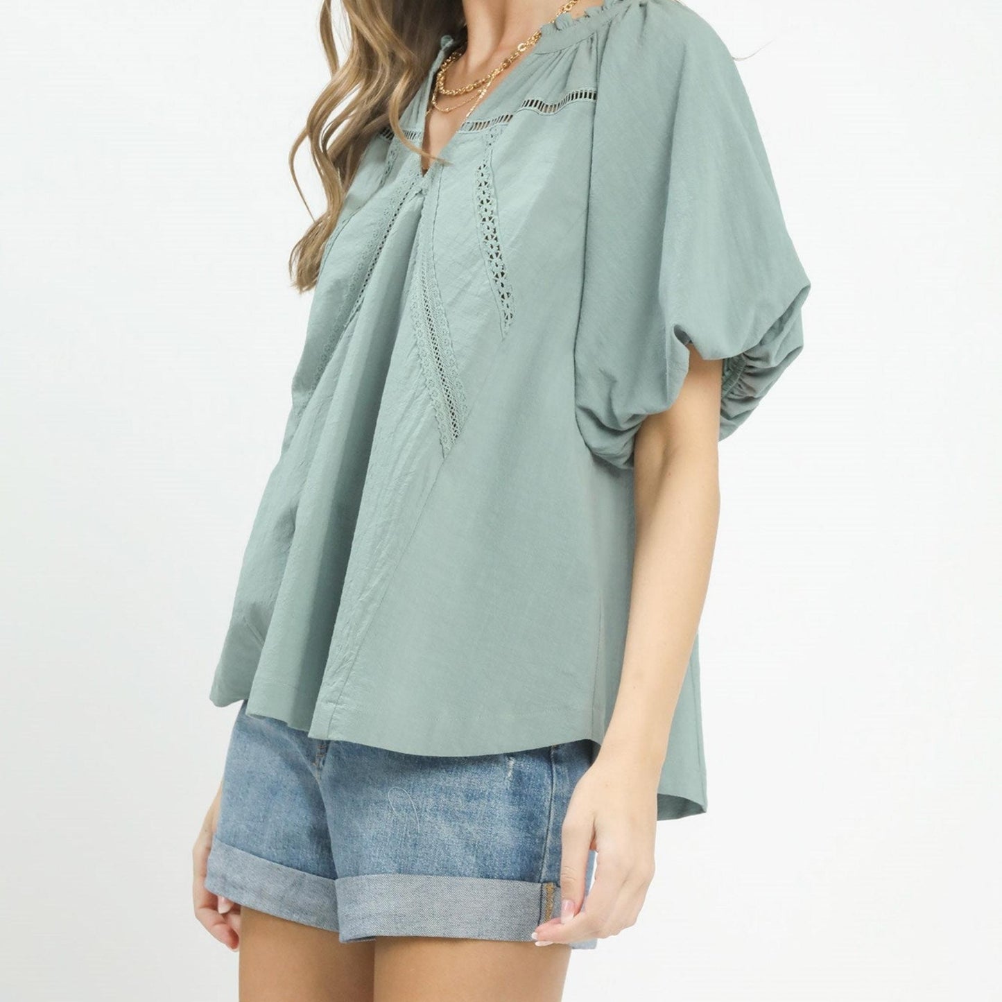 Side view of the Umgee mint blue boho blouse showing the relaxed, flowy silhouette.