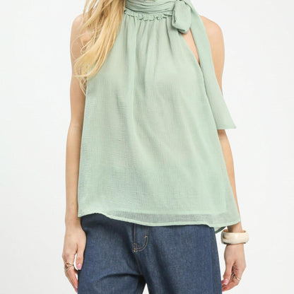 Front view of the Umgee mint sleeveless halter tie neck chiffon top.