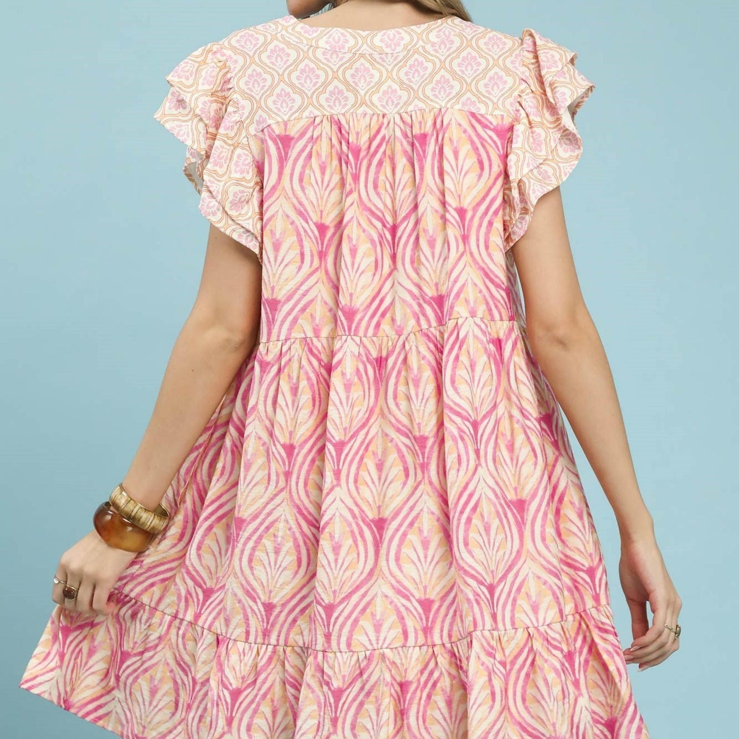 Back view of the Umgee mix printed dress showing the relaxed, flowy silhouette.