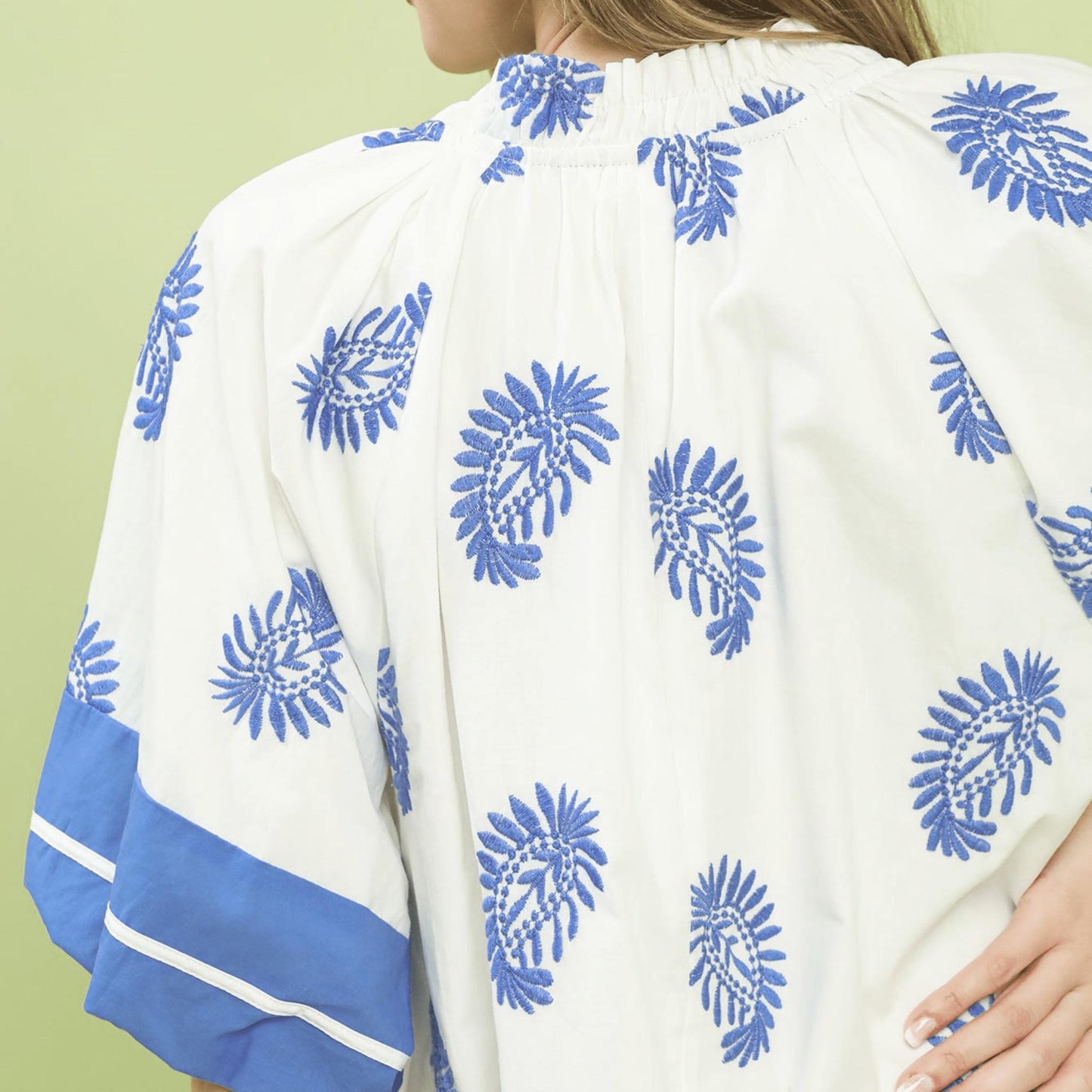 Close-up of the intricate paisley embroidery and V-neckline on the Umgee boho dress.