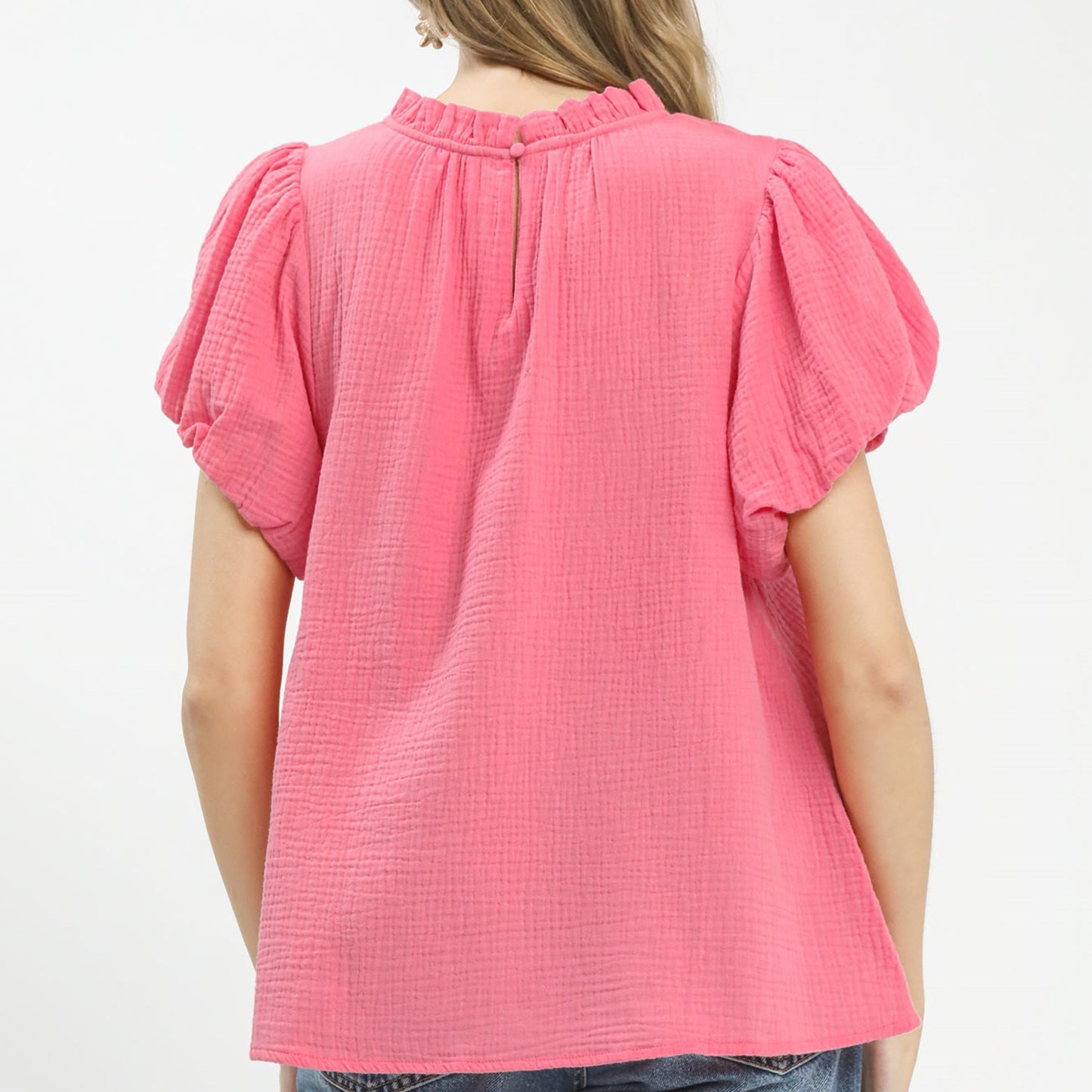 Back view of the pink cotton gauze top highlighting the airy and breathable material.