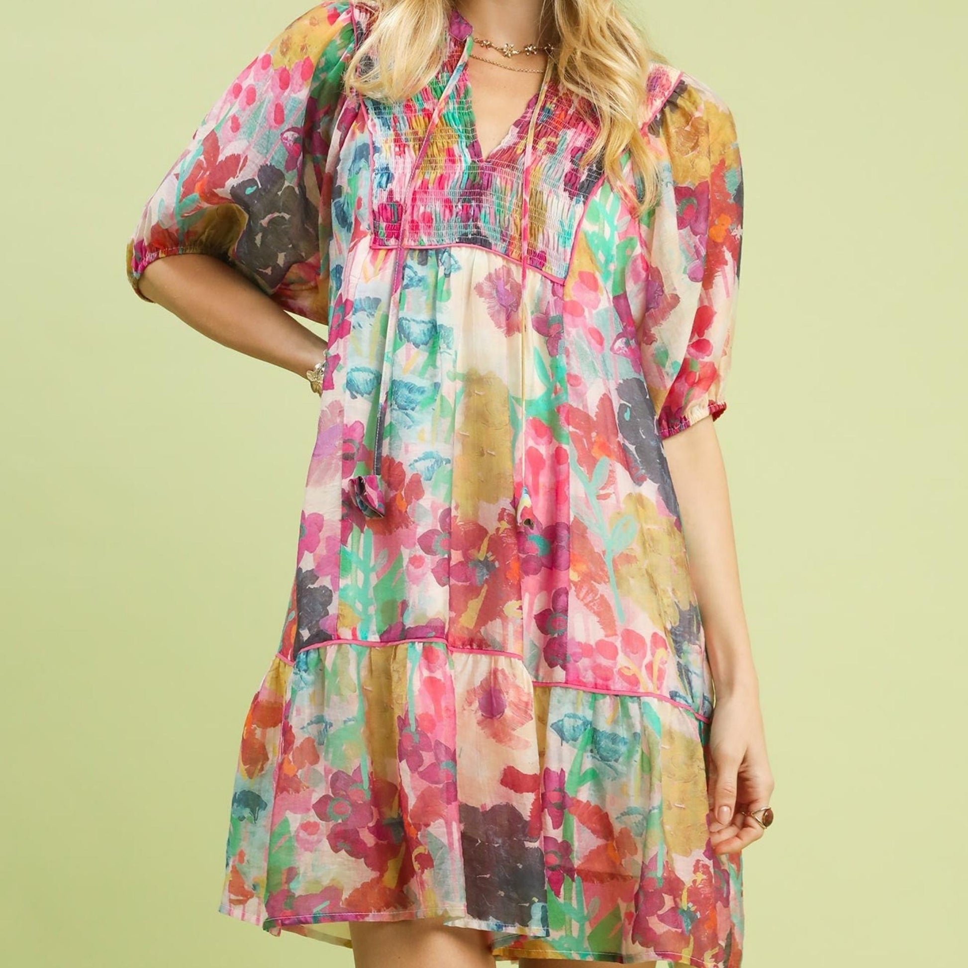 Front view of the Pink Mix Umgee watercolor floral babydoll dress in a soft pastel print.