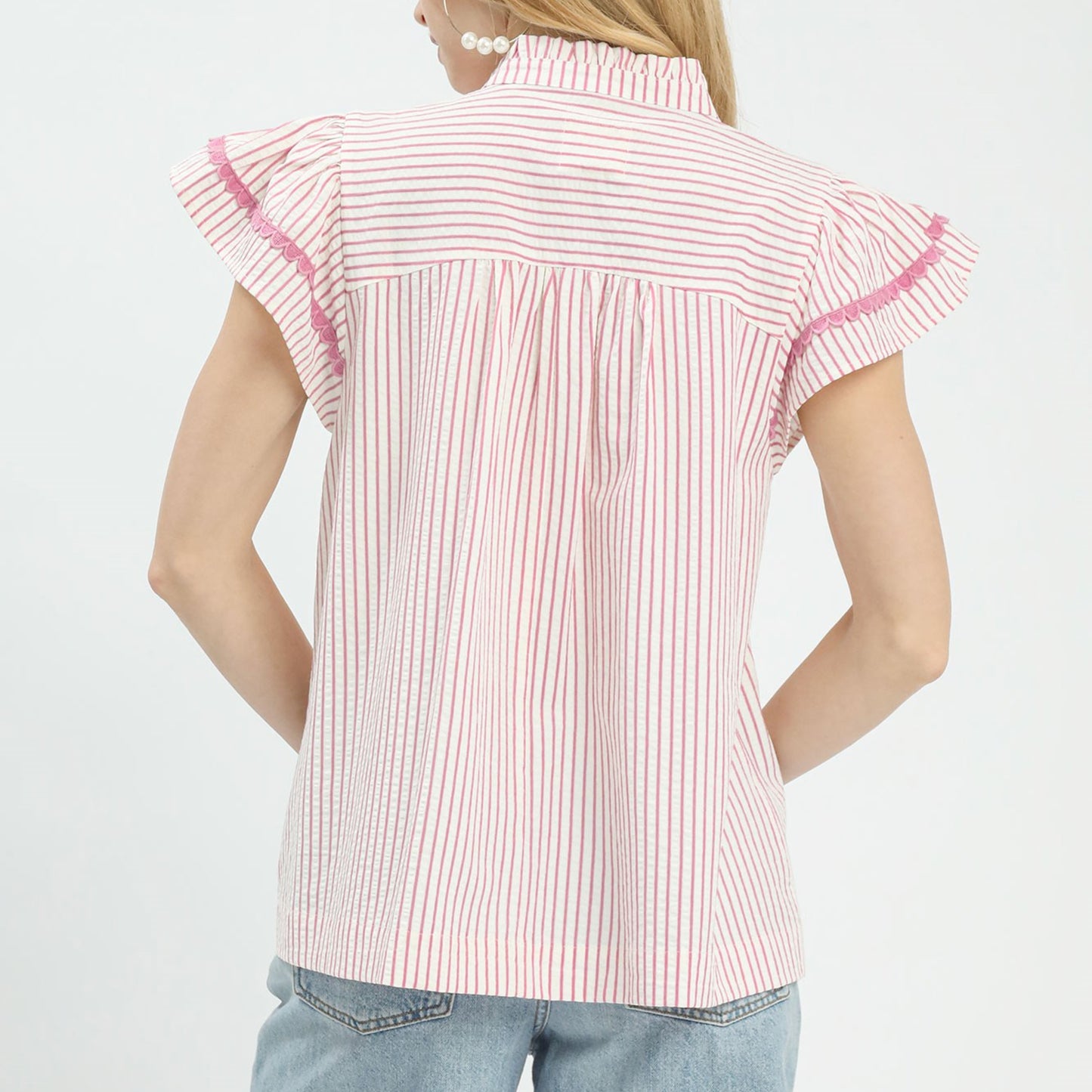 Back view of the pink striped top showing the relaxed and comfortable fit.