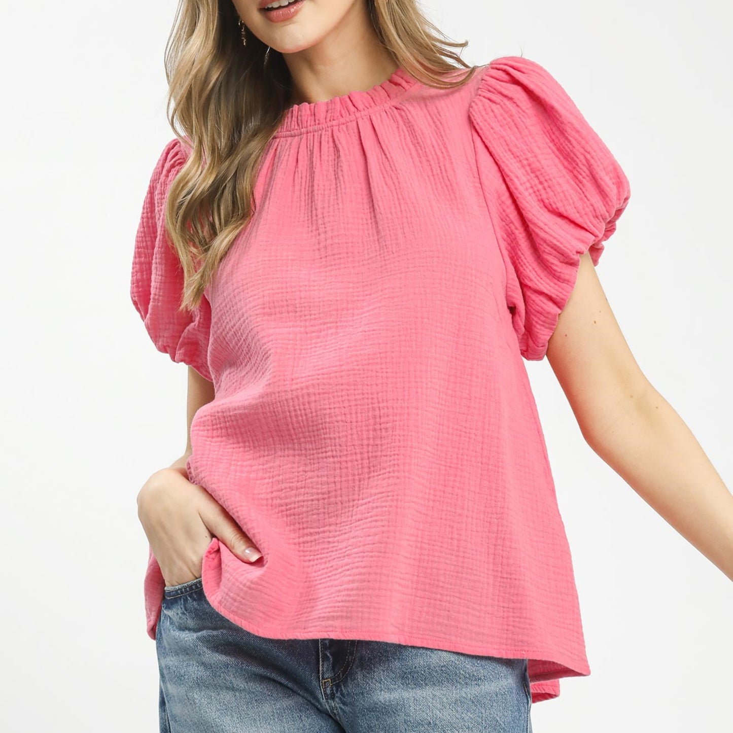 Front view of the Umgee textured gauze ruffle neck boho top in pink.