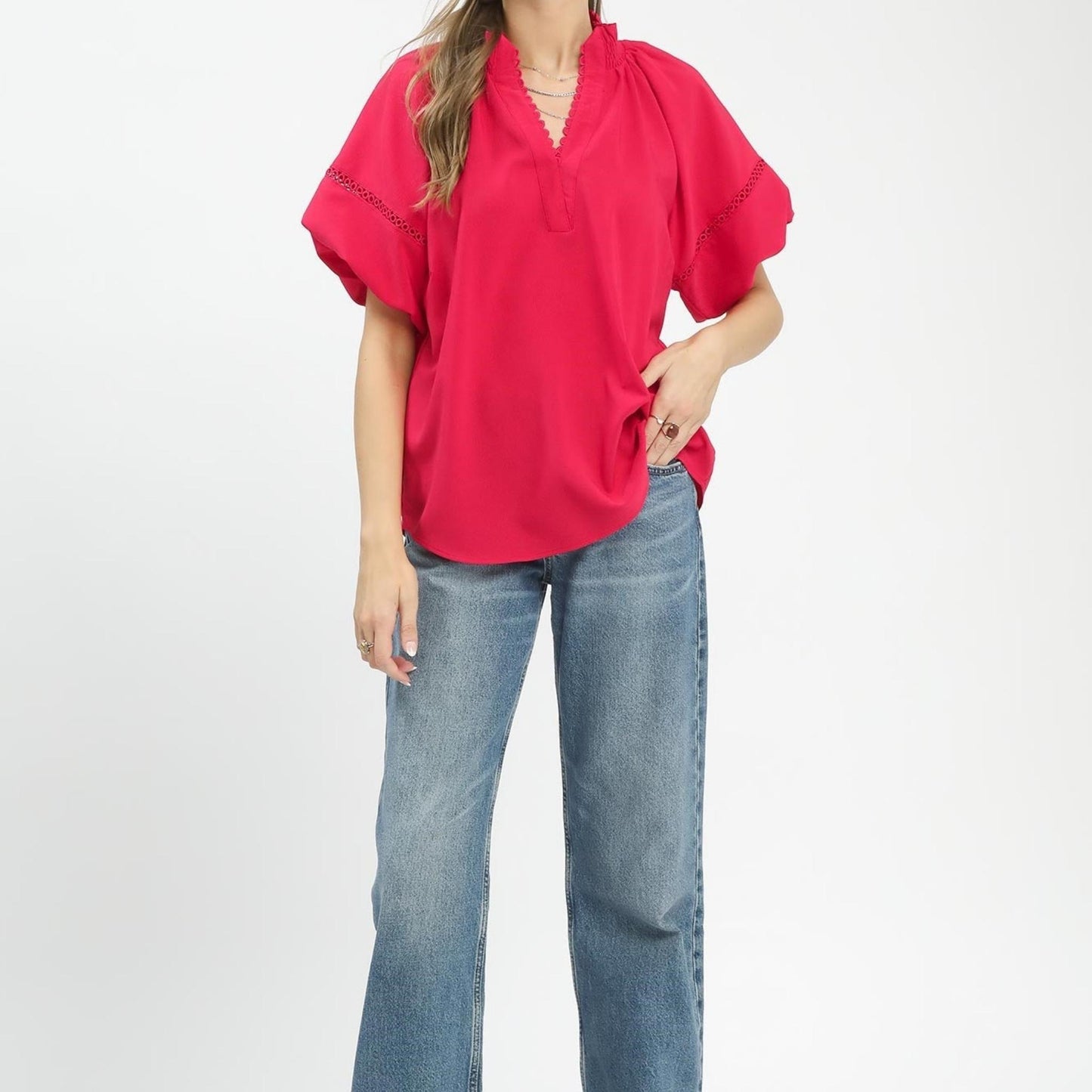 Full-length view of the Umgee lace trim peasant top styled with jeans for a summer look.