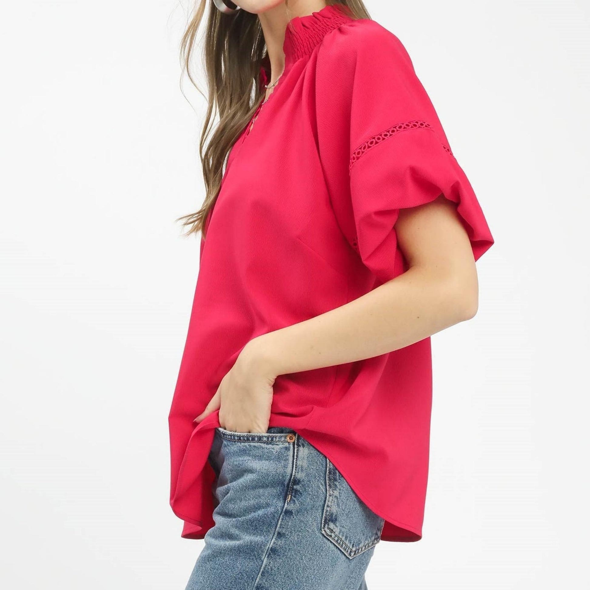 Side profile of the Umgee peasant top showing the billowy sleeve design and relaxed fit.