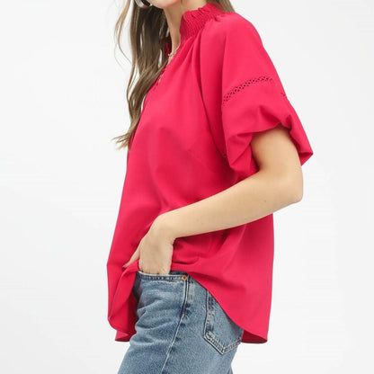 Side profile of the Umgee peasant top showing the billowy sleeve design and relaxed fit.