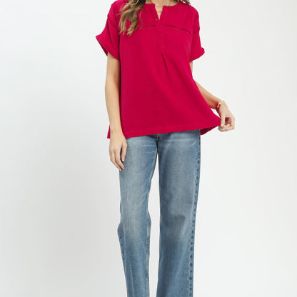 Lifestyle shot of the red split-neck boho blouse for a vibrant and effortless look.