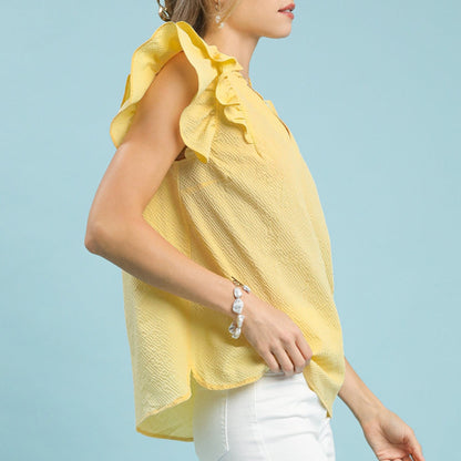 Side view showing the flattering V-neckline and tiered ruffle sleeve detail.