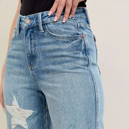Styling shot of star-shaped destroy 90s straight jeans.