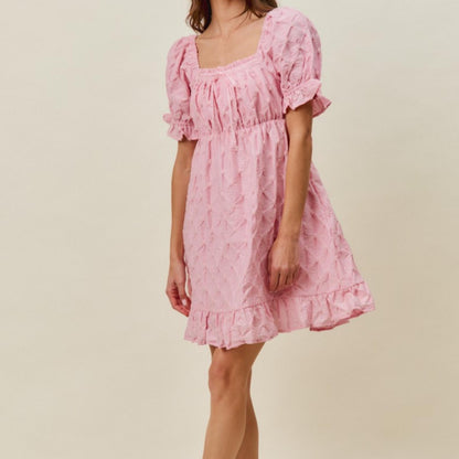 Full-length view of the romantic SO ME pink ruched bust mini dress.