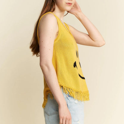 Side view of the mustard yellow graphic tank showing the relaxed fit.