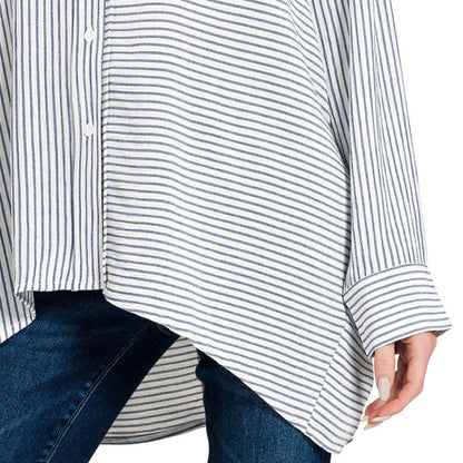 A professional boutique display of the blue striped button-down shirt on a minimalist hanger.