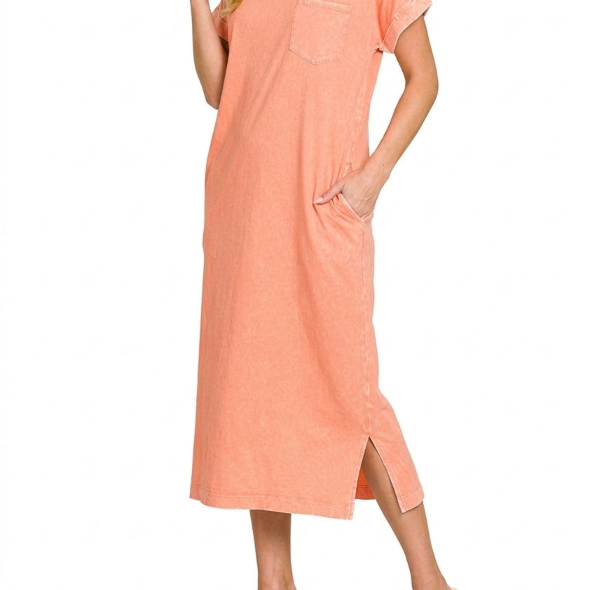 Side view highlighting the functional pockets and side slit on the washed coral T-shirt dress.
