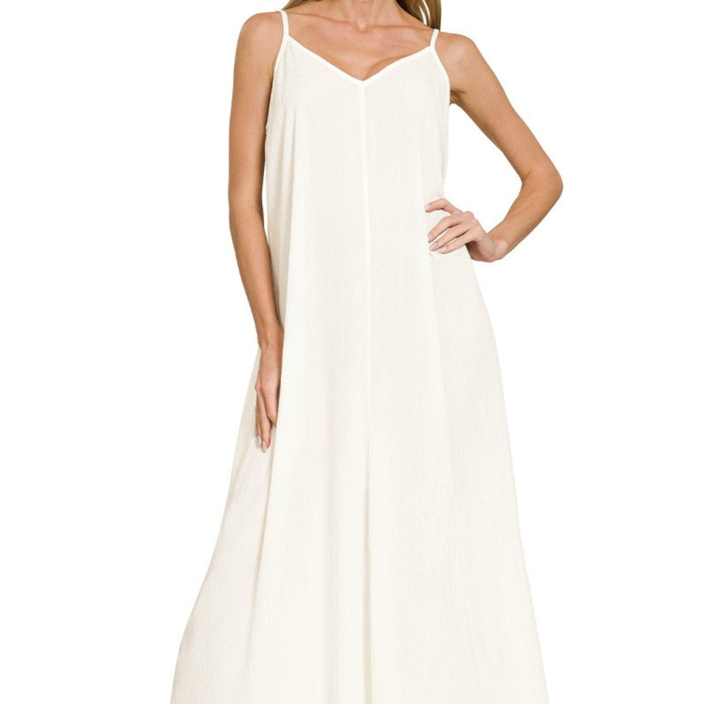Model wearing the ivory Zenana woven crinkle maxi dress for a bright coastal morning.