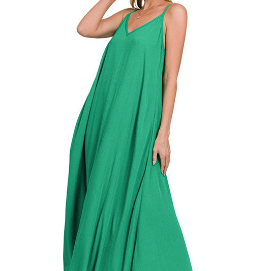 Close-up highlighting the elegant side slit detail on the flowy K green woven maxi dress.