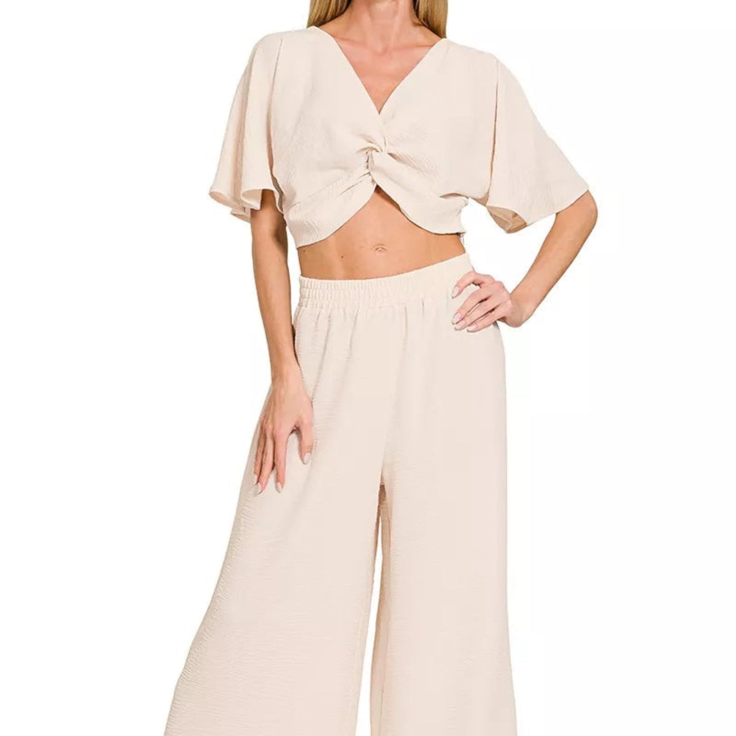 Model wearing the sand beige Zenana airflow set for a sophisticated coastal look.