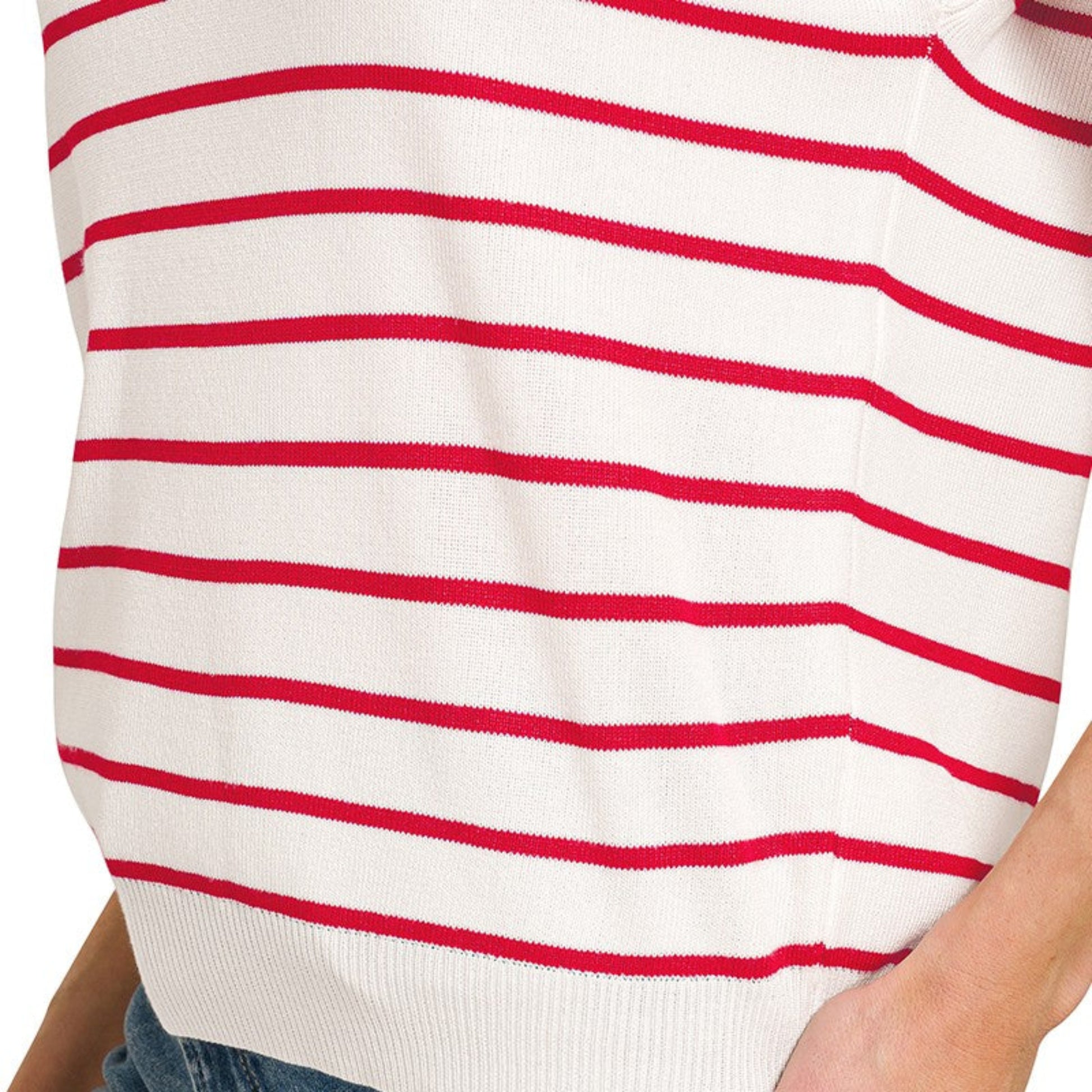 A realistic everyday outfit featuring the ruby striped knit vest layered over a white long-sleeve tee.