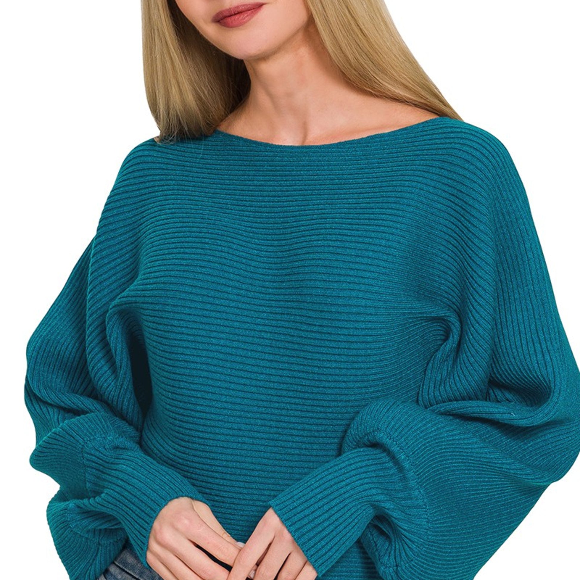 Close-up of the ribbed texture and balloon sleeve detail on the Ocean Teal sweater.